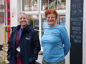 Cara Headon (left) and Jill Doubleday (right) standing in-front of a cafe