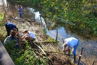 Volunteers implementing natural flood management measures