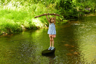 Child playing in river © Sally Broom