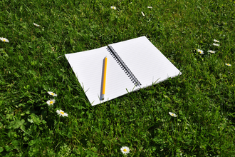 Notepad on grass © Hampshire & Isle of Wight Wildlife Trust