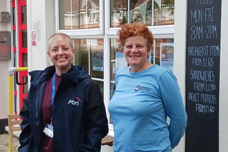 Cara Headon (left) and Jill Doubleday (right) standing in-front of a cafe