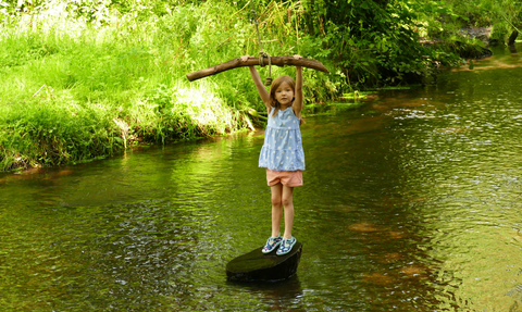 Child playing in river © Sally Broom