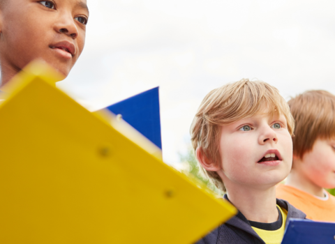 school children with clipboards 